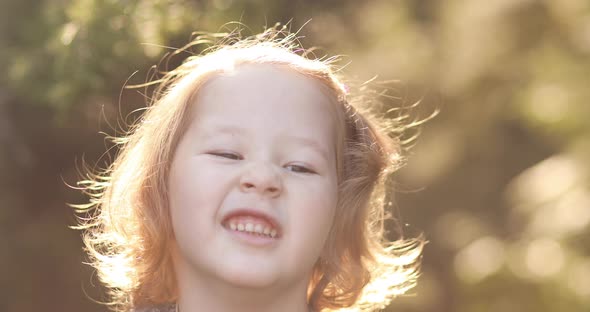 Little Kid Playing in Beautiful Sunny but Cold Day Outside