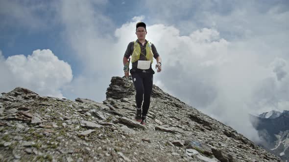 Running Man on a Rocky Trail in a High Mountains Epic Adventure Healthy Fitness Lifestyle Training