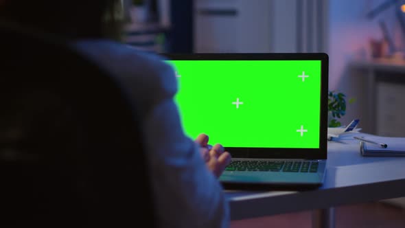 Close Up of Freelancer Typing on Laptop with Green Screen Overtime alt