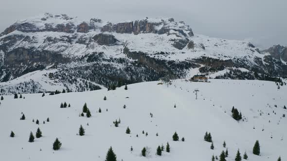 Aerial, Winter Landscape In Dolomites Mountains On A Cloudy Day In Italy