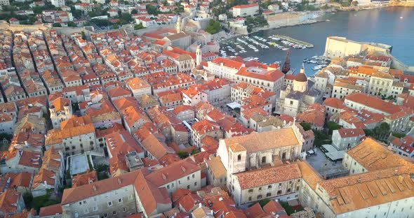 Aerial View of Roofs of Old Town Dubrovnik Croatia. Drone Flies Over Old Roofs on Sunset alt