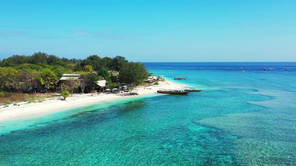 Aerial flying over travel of relaxing coast beach trip by blue ocean and clean sand background of a  alt