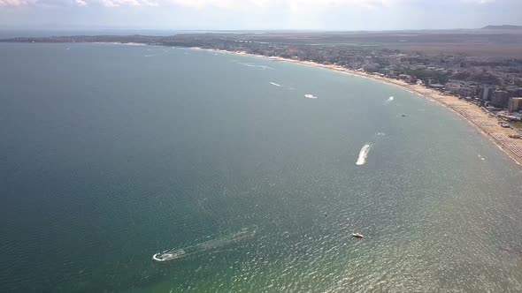 Aerial view of Sunny Beach city that is located on Black Sea shore. Top view of sand beaches with  alt