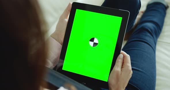 Woman Holding Tablet Chromakey Indoors