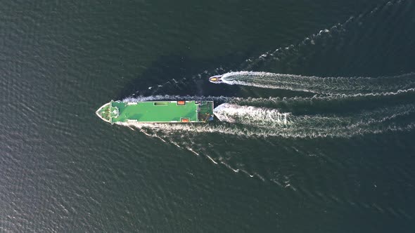 Large Car Ferry RoRo with a Pilot Boat alt