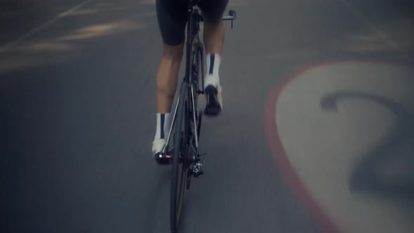 Cyclist Training Leisure Twists Pedals On Triathlon Bicycle. Gear System  And Bike Wheel. alt