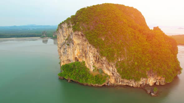 Aerial view over the coast, mountains and beaches during beautiful sunsets alt