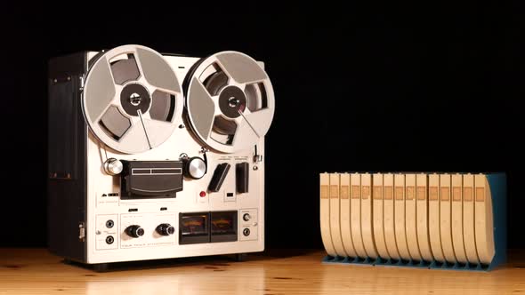 Taperecorder playing music isolated on black background and space for copy alt