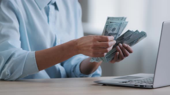 Unrecognizable Female Cashier Hands Woman Counting Large Stack of Hundred American Dollar Bills alt