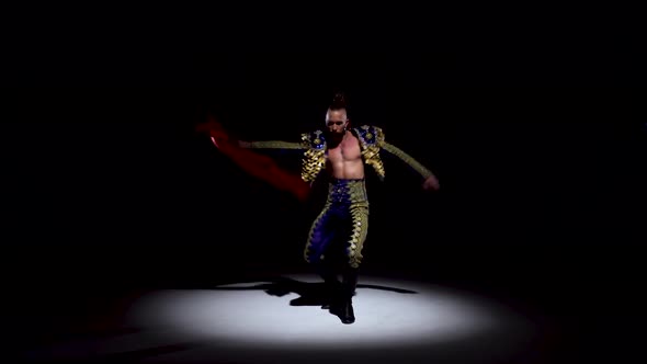 Torero in Blue and Gold Suit or Typical Spanish Bullfighter Isolated Spotlight on a Black Background alt