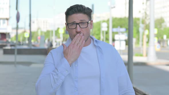 Loving Man Giving Flying Kiss By Hands Outdoor alt