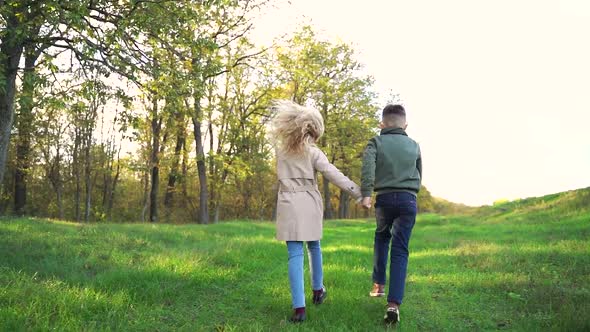 Anonymous Little Couple Having Fun Near Forest Together alt