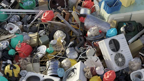 Loopable animation with the rubbish dump. Dirty plastic, metal and paper garbage alt