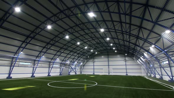 Indoor Football Field with White Marking and Gate at Stadium alt