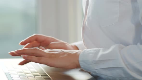 Close-up Woman Working on a Laptop. Concept of Remote Work. alt
