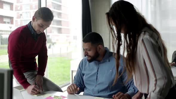 Business Team Discussing Ideas for Project alt