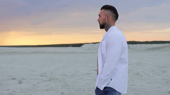 Brutal Man Walking on Beach