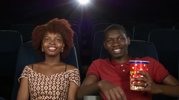 Happy African American Couple, Watching Movie In Theatre, Close Up alt