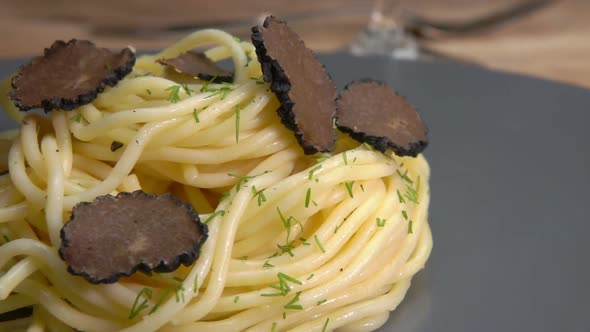 Slices of a Black Truffle Fall on the Spagetti alt