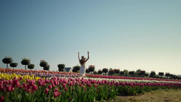 Girl Running Tulip Field View alt