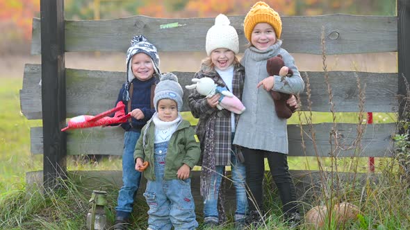 Happy family children kid together on an autumn field in the countryside alt