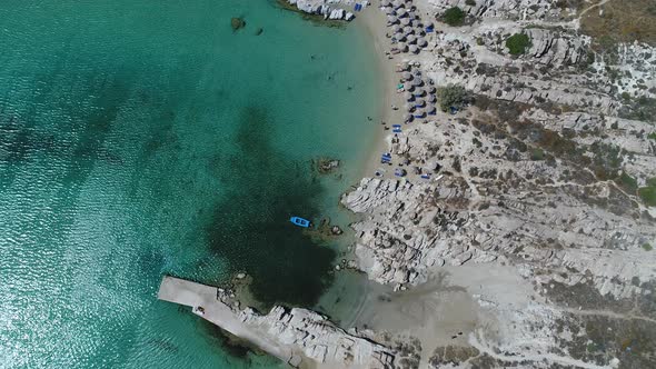 Piperi beach in Naoussa on Paros island in the Cyclades in Greece aerial view alt