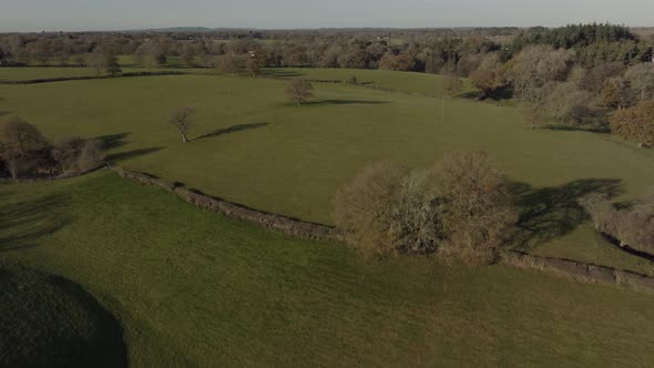 English Countryside Establishing Shot Green Agricultural Grass Fields Landscape Aerial View Trees