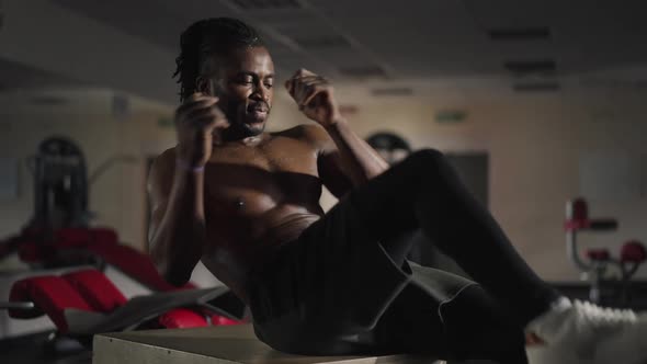 Confident Handsome Sportsman Training Belly Press Exercising in Gym Indoors alt