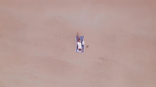 Drone Fromwoman Lying On Beach Towel On Nacpan Beach alt