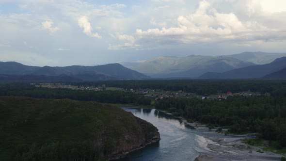 Majestic river Katun in valley of Altai under dramatic sky