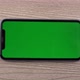 Smartphone with Green Screen Mockup Swipe Scroll Hand Close Up Mobile Phone User
