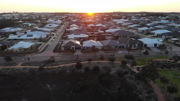 Aerial View of a Suburb with Sunset