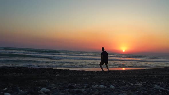 Happy Man Running on Beach Jumping and Celebrating Success alt