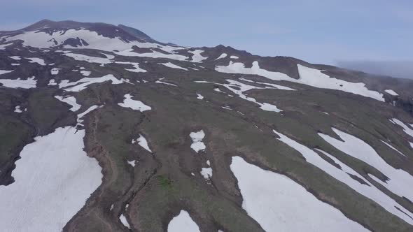 Aerial Footage of the Gorely Volcano Peaks Rising Above the Fog