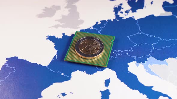 2 Euro Coin Over a CPU on an EU Map Symbolizing the Digital Euro alt
