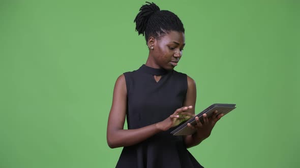 Young Beautiful African Businesswoman Using Digital Tablet