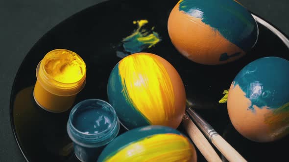 Painted YellowBlue Easter Eggs are Spinning alt