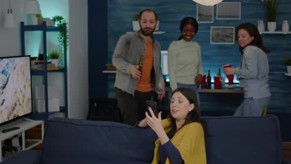 Multiracial Friends Hanging Out Together Socializing While Looking at Funny Video alt