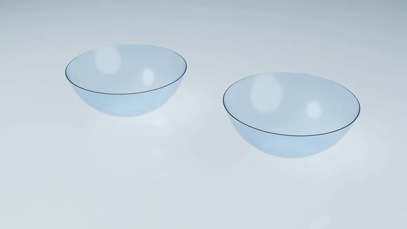 Couple of contact lens on clean reflection floor in laboratory