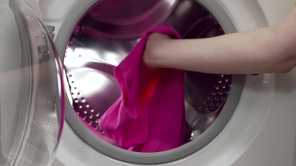 Putting the Dirty Clothes To the Washing Machine, in the Laundry, Washday, Using the Washer alt