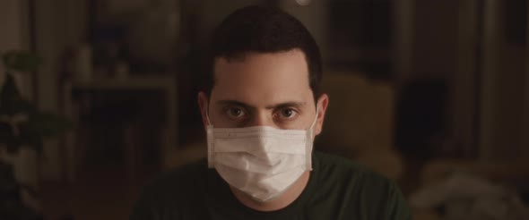 Portrait of A Young Man Wearing a Protective Mask alt