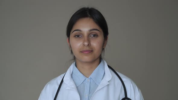 Confident Smiling Indian Female Doctor Wear White Coat Look at Camera Portrait alt