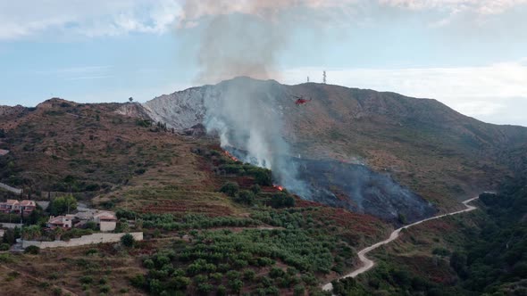 Firefighting Helicopter Drops Water