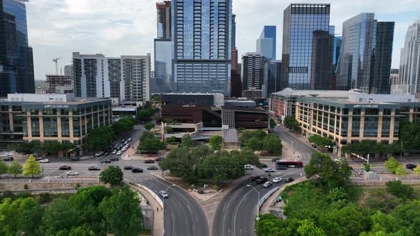 Rising aerial shot of traffic in Austin, Texas. Urban planning and southern city theme. Skyscrapers alt