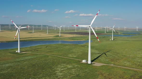 Aerial View of Windmills on Wind Farm in Rotation alt