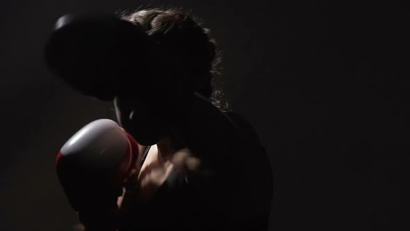 Aggressive Female Muay Thai Boxer Training Before Fight, Self-Defense Course alt