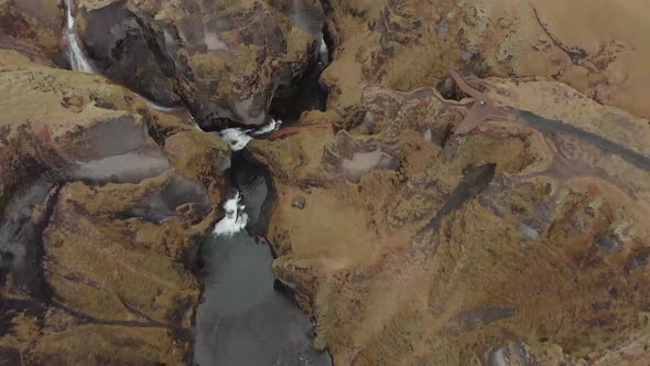 Cinematic aerial flyover of stunning Icelandic canyon. alt