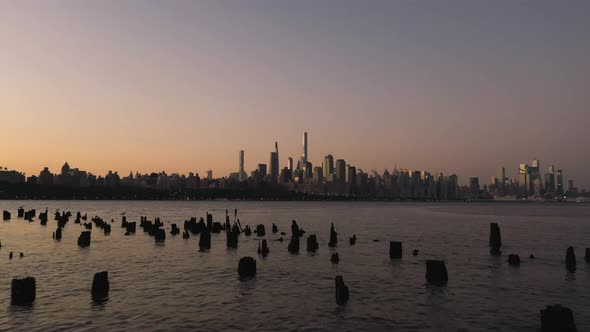 Morning Skyline in New York City and River with Pier