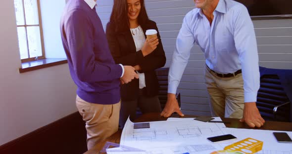Executives talking in conference room at office 4k alt