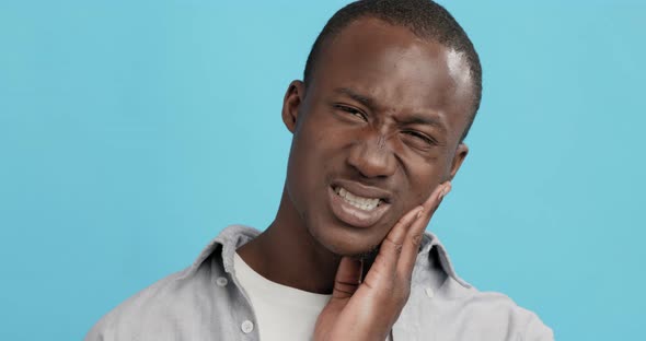 Emotional Guy with Toothache Touching His Sore Cheek alt